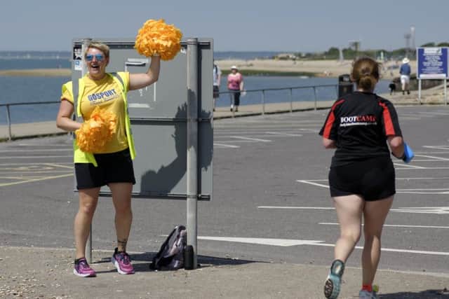 Jo Hopkins, from Gosport Road Runners, cheers on one of the runners. Picture: Neil Marshall (170313-9)