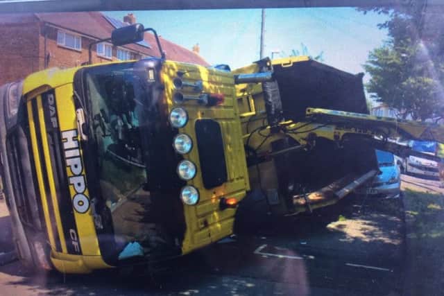 A Hippo waste lorry has overturned in Abbeydore Road, PaulsgrovePicture: Hants Road Police / Twitter