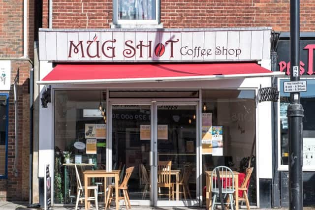 The blank side wall of Mud Shot Coffee Shop needs brightening up by a talented artist