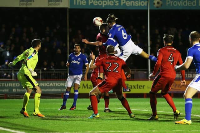 Christian Burgess scores in the victory over Crawley in March Picture: Joe Pepler