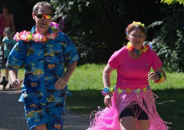 Ian Jones and Gissele Leishman during the Havant parkrun with Hawaii theme. Picture: Keith Woodland
