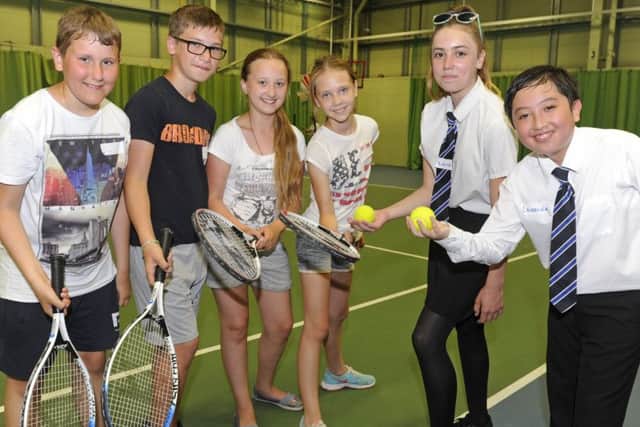 (L-r) Dima Shcherbak, Nikita Krasov, Nastia Konovalova and Emma Irza with Priory School pupils Nikita Morris and Laurence Trinh.  Picture: Ian Hargreaves  (170737-1)