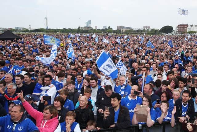 Pompey fans at Southsea Common celebrating the Blues' League Two title win. Picture: Joe Pepler