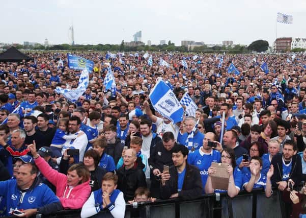 Pompey fans at Southsea Common celebrating the Blues' League Two title win. Picture: Joe Pepler