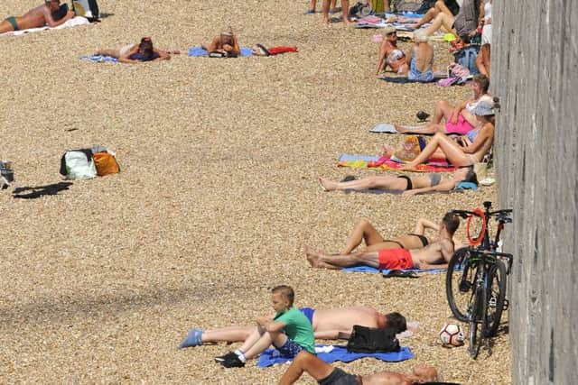 Sun-lovers at the Hot Walls in Old Portsmouth earlier this week