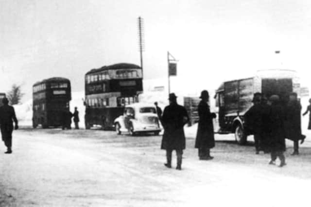 A reversal of the present weather, here we see traffic at a standstill on the summit of Portsdown Hill, 1941.