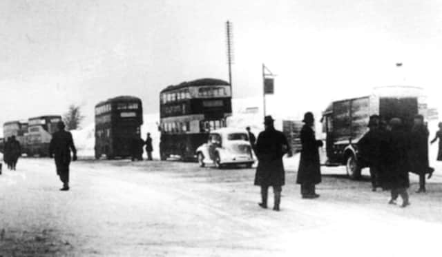 A reversal of the present weather, here we see traffic at a standstill on the summit of Portsdown Hill, 1941.