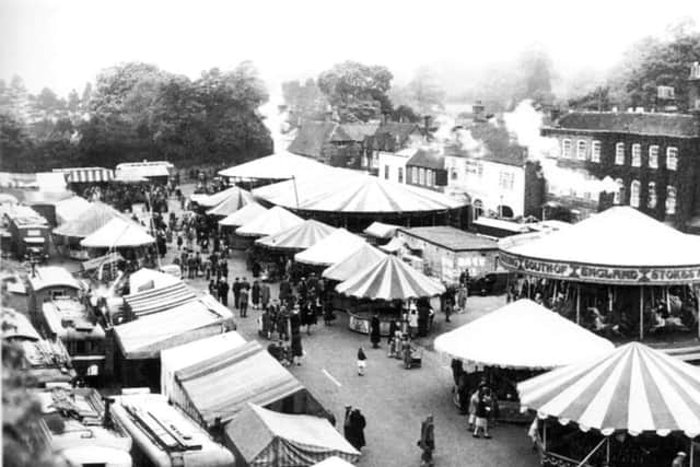 Steam gallopers (roundabouts) make up all the fun of the fair in this travelling showmens fair at Wickham, circa 1946.