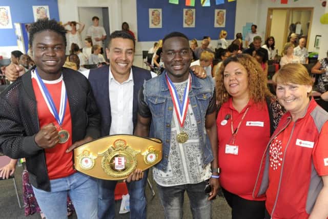 From left, Walid Adenas, boxing coach Q Shillingford, Ahmed Adenas, and Shamila Dhana and Frances Pilling from the Red Cross
Picture: Ian Hargreaves (170734-1)