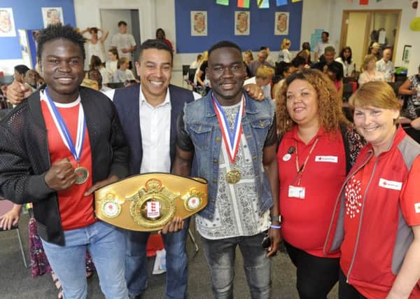 From left, Walid Adenas, boxing coach Q Shillingford, Ahmed Adenas, and Shamila Dhana and Frances Pilling from the Red Cross 
Picture: Ian Hargreaves (170734-1)