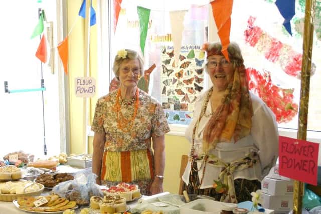 Worshippers looking after the cake stall last year