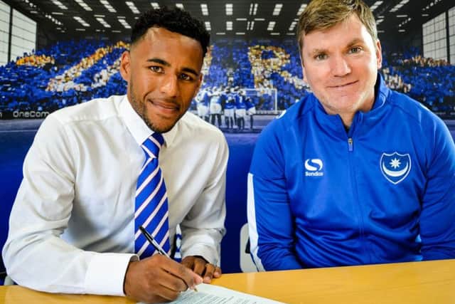 Nathan Thompson signs for Pompey in the company of Blues assistant manager Joe Gallen Picture: Joe Pepler
