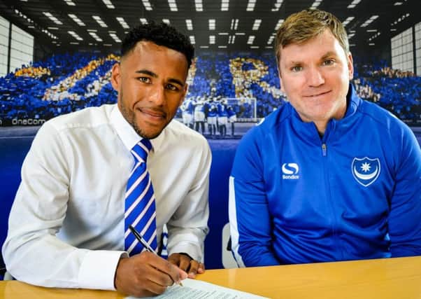 Nathan Thompson signs for Pompey in the company of Blues assistant manager Joe Gallen Picture: Joe Pepler
