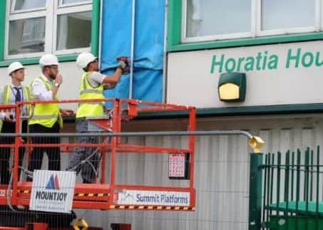 Cladding is removed from Horatia House Picture: Sarah Standing (170831-9636)