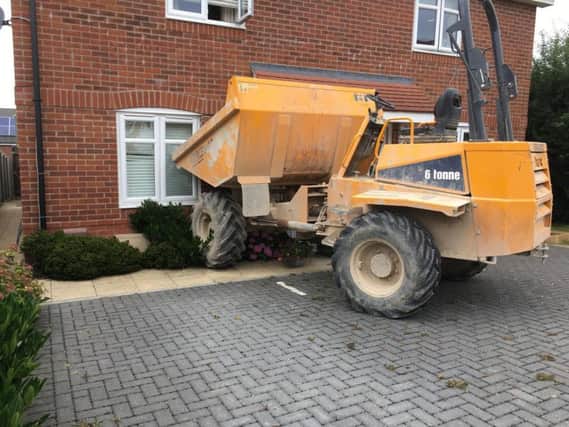 A dump truck was driven into a house in Whiteland Way, Clanfield this morning