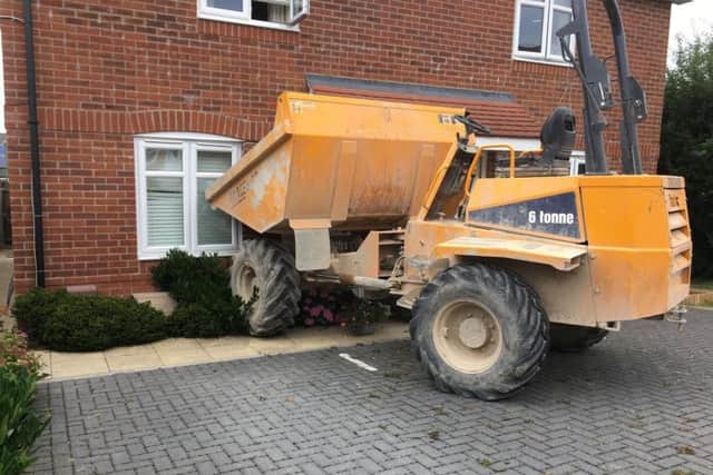 A dump truck was driven into a house in Whiteland Way, Clanfield.