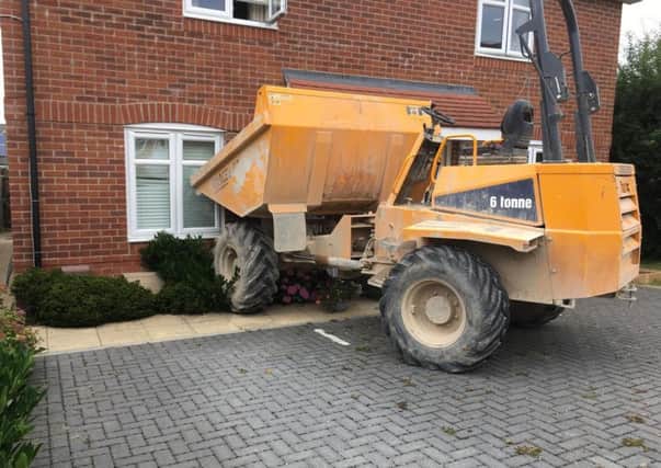 A dump truck was driven into a house in Whiteland Way, Clanfield.
