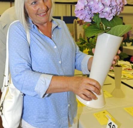 Caroline Brook,s from Hayling Island, with her dad's award-winning hydrangea.
Picture Ian Hargreaves (170743-1) PPP-170624-190452006