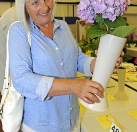 Caroline Brook,s from Hayling Island, with her dad's award-winning hydrangea. 
Picture Ian Hargreaves  (170743-1) PPP-170624-190452006