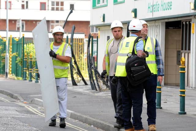 Cladding was being removed from Horatia House and Leamington House throughout the weekend. Picture: Sarah Standing