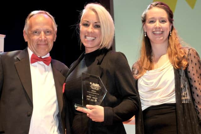 Steph Smith (left) and Caitlin Earey, from Rock Up, winners of Leisure Venue of the Year, with Colin Wilding from Gunwharf Quays at the 2016 Retail & Leisure Awards