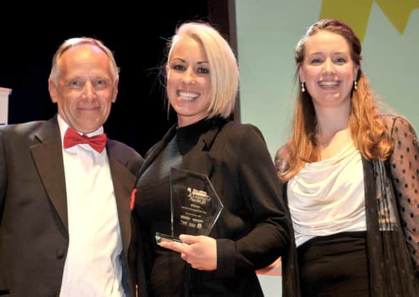 Steph Smith (left) and Caitlin Earey, from Rock Up, winners of Leisure Venue of the Year, with Colin Wilding from Gunwharf Quays at the 2016 Retail & Leisure Awards