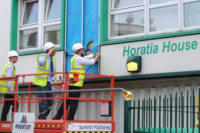 The scene on Friday afternoon, as work begun to remove cladding from Horatia House, Somers Town.
Picture: Sarah Standing (170831-9641) PPP-170623-182618001