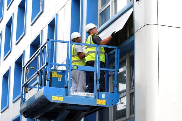Cladding being removed from Leamington House on Friday. Picture: Sarah Standing (170831-9698) PPP-170623-182756001