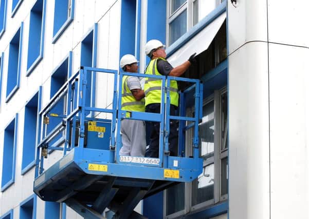 Cladding being removed from Leamington House on Friday. Picture: Sarah Standing (170831-9698) PPP-170623-182756001