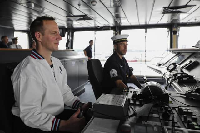 Chief Petty Office Physical Training Instructor Andrew Vercoe on HMS Queen Elizabeth's bridge