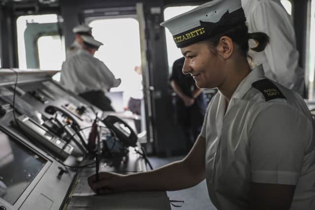 Able Seaman Jess Hewes logs the ship's events in the ship's log as she sails out for the first time