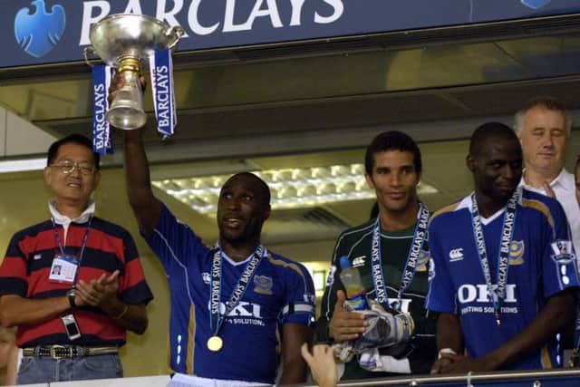 Sol Campbell lifts the Barclays Asia Trophy. Picture: Will Caddy