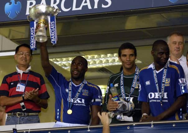 Sol Campbell lifts the Barclays Asia Trophy. Picture: Will Caddy
