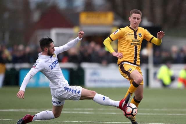 Adam May, right, in FA Cup action for Sutton United against Leeds