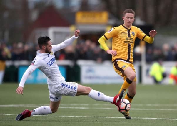 Adam May, right, in FA Cup action for Sutton United against Leeds