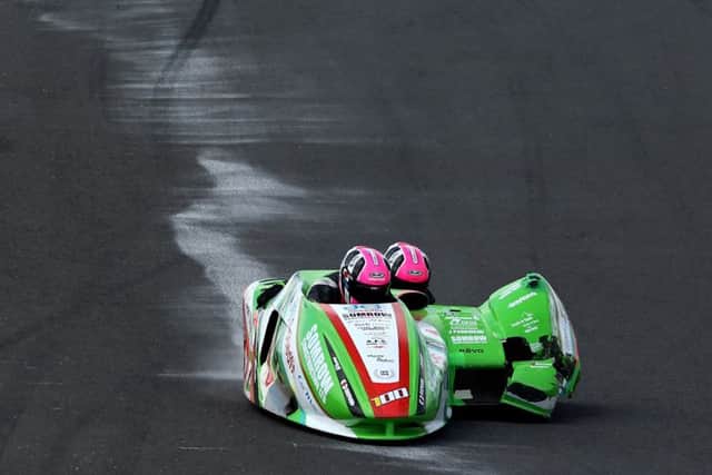 Ricky Stevens and Ryan Charlwood driving their damaged sidecar at Knockhill. Picture: Tim Keeton/Impact Images