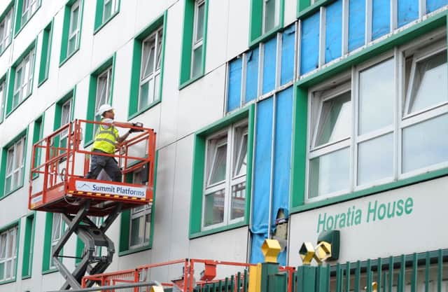 23/6/2017 (BM/BF)

Cladding was being removed from Horatia House and Leamington House on Friday evening.

Picture: Sarah Standing (170831-9658) PPP-170623-182636001