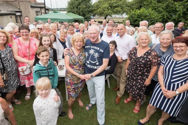 Canon Mike Sheffield from St George's Church, Waterlooville, retired after 13 years of service at that church - pictured with his wife Lynda and guests Picture: Keith Woodland