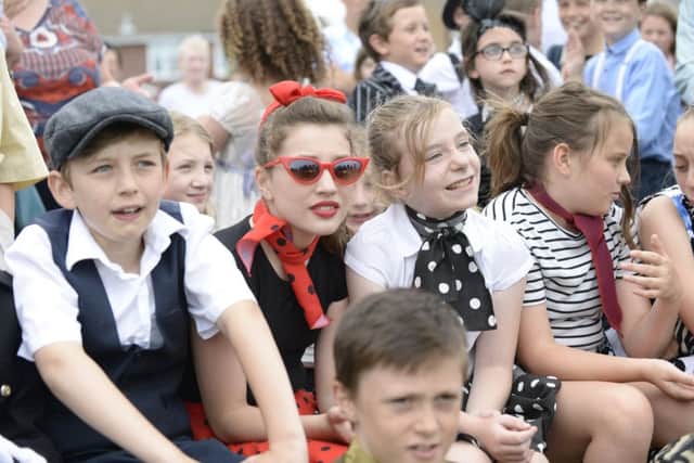 The junior choir dressed in fancy dress from across the decades. The cool gang were Year Six pupils Theo Johnson, Sophie Messenger, CoboRebecca Bell,  Poppy Lloyd, Oliver Terry.  Picture by Nick Scott Photography.