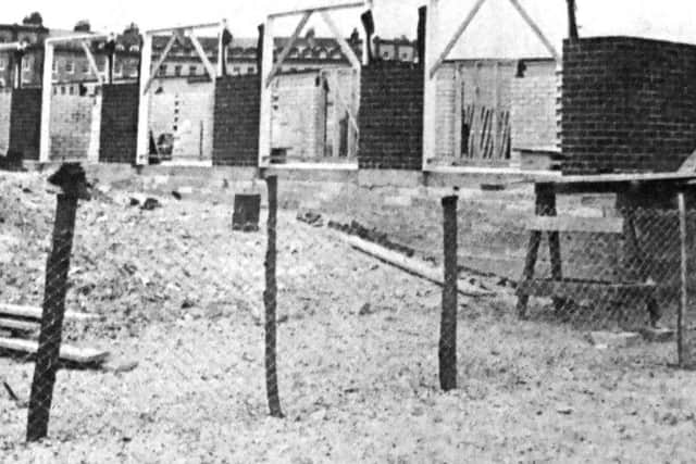 Residents on the Sea Front on Hayling Island complain about the row of beach huts, they have nicknamed the 'Berlin wall', being built along the shore.
(7546-1)