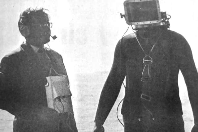 Tony Evans (left) and Maurice Harknett testing the telephone communication system, installed in a free diving outfit.