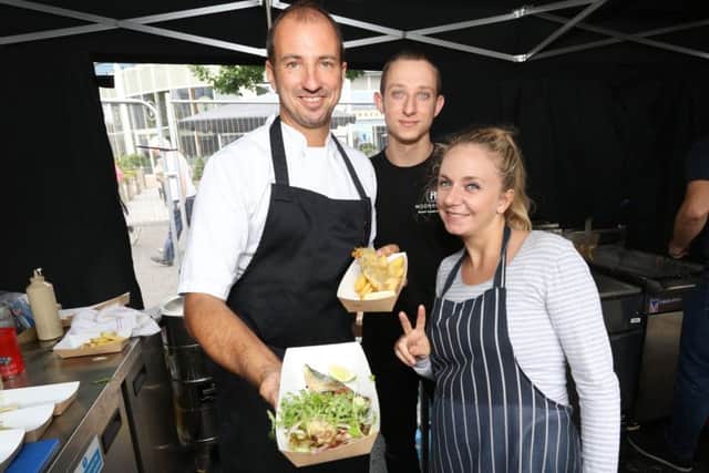 Gary and Hayley Morton-Jones and Ian Clarke preparing fish and chips. PPP-170625-001008006