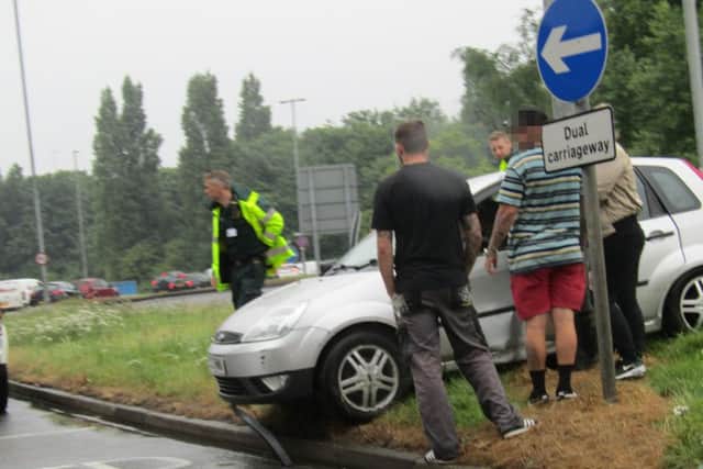 Driver and passengers of the damaged car at the scenePicture: Debz Croker