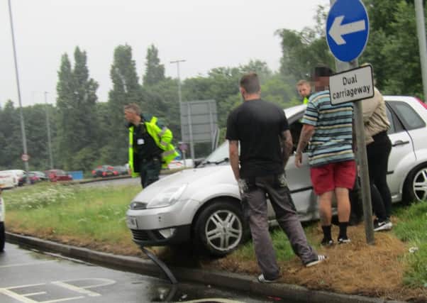 Driver and passengers of the damaged car at the scene


Picture: Debz Croker