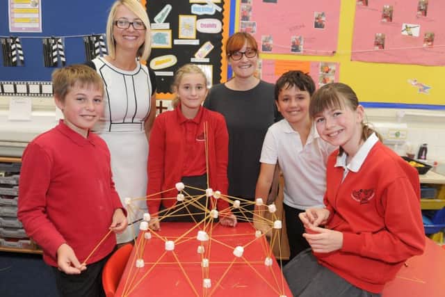Haselworth Primary School pupils with headteacher Emma Steele - from left: Cai Richardson, 10, Mia Harley, 11, Year 2 teacher and science leader Cheryl Collins, Tommy Davis, 11, and Charlotte Hallsworth, 11, making the highest tower out of spaghetti and marshmallows during a science lesson                   Picture: Sarah Standing (170837-4248)