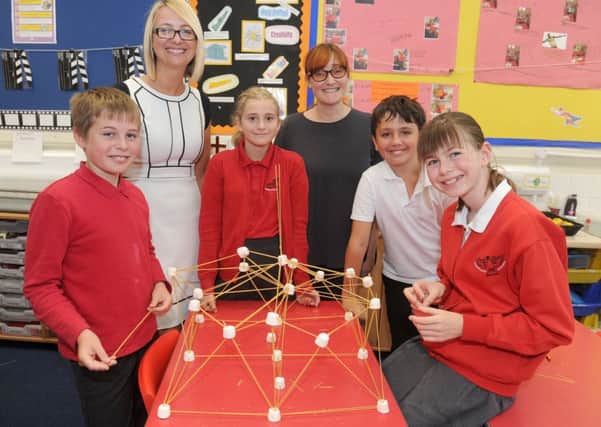 Haselworth Primary School pupils with headteacher Emma Steele - from left: Cai Richardson, 10, Mia Harley, 11, Year 2 teacher and science leader Cheryl Collins, Tommy Davis, 11, and Charlotte Hallsworth, 11, making the highest tower out of spaghetti and marshmallows during a science lesson                   Picture: Sarah Standing (170837-4248)