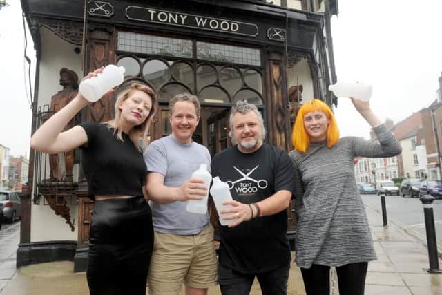 Andrew Gadsden and Tony Wood with, left, Elsie-May Simmonds and, right,  Carla Whiteofrd, apprentice hair stylistsPicture: Sarah Standing (170839-4303)