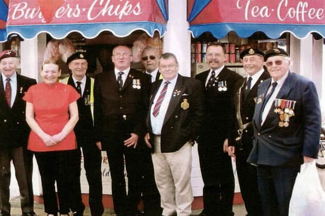 Hazel Pople with veterans on the seafront