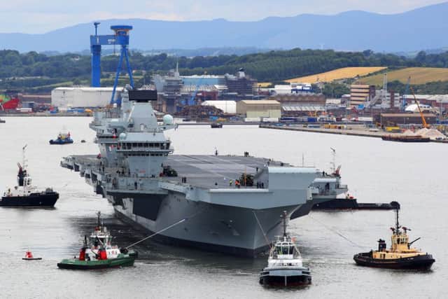 HMS Queen Elizabeth leaves Rosyth dockyard for the first time this week