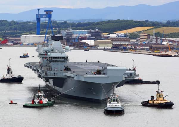 HMS Queen Elizabeth leaves Rosyth dockyard for the first time this week